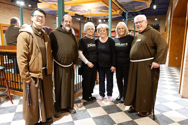Br. Tien, Br. Rob and Br. Gary with volunteers from Kohl's at the 2023 Bocce with the Brothers event