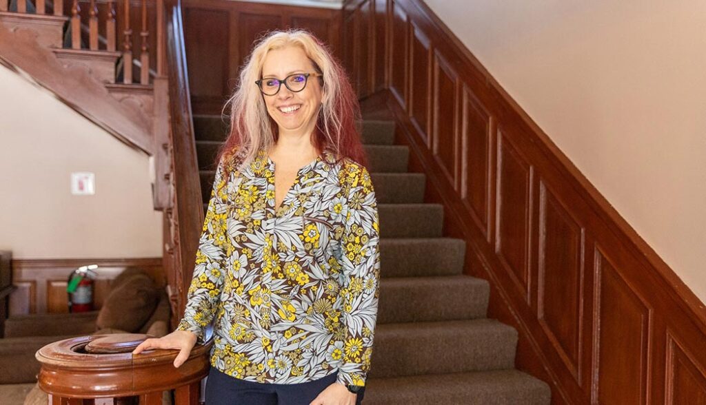 Amy poses for a photo in the foyer of Jefferson House.